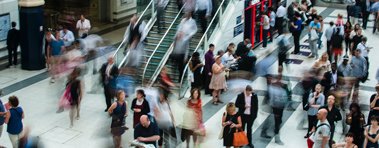 crowd of fast moving people at a mall